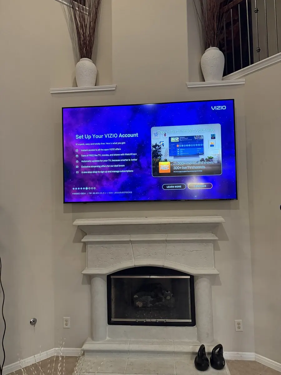 TV mounted above fireplace with concealed wires, Houston TX #4