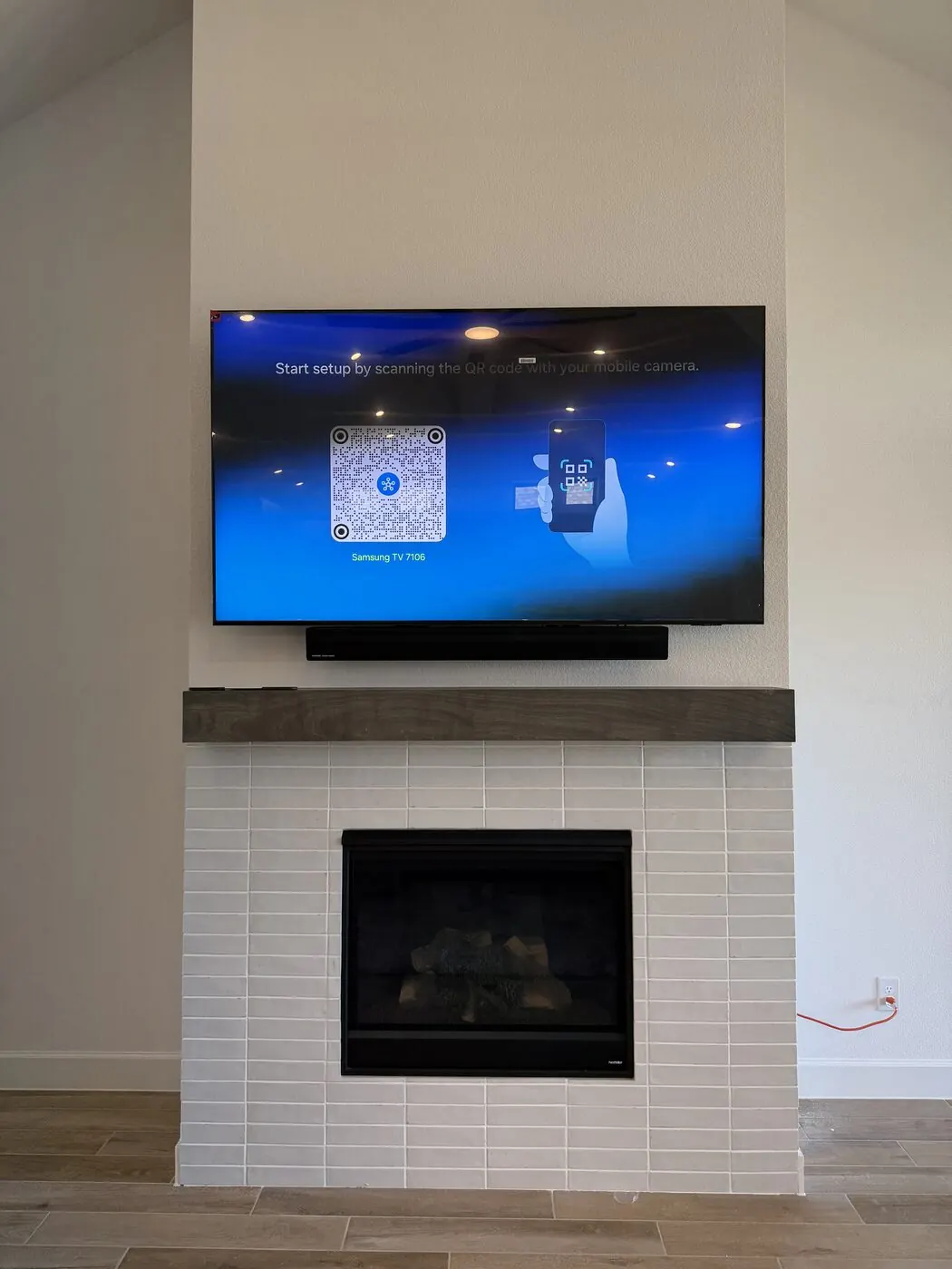 Clean finished fireplace TV mount, wires hidden in wall
