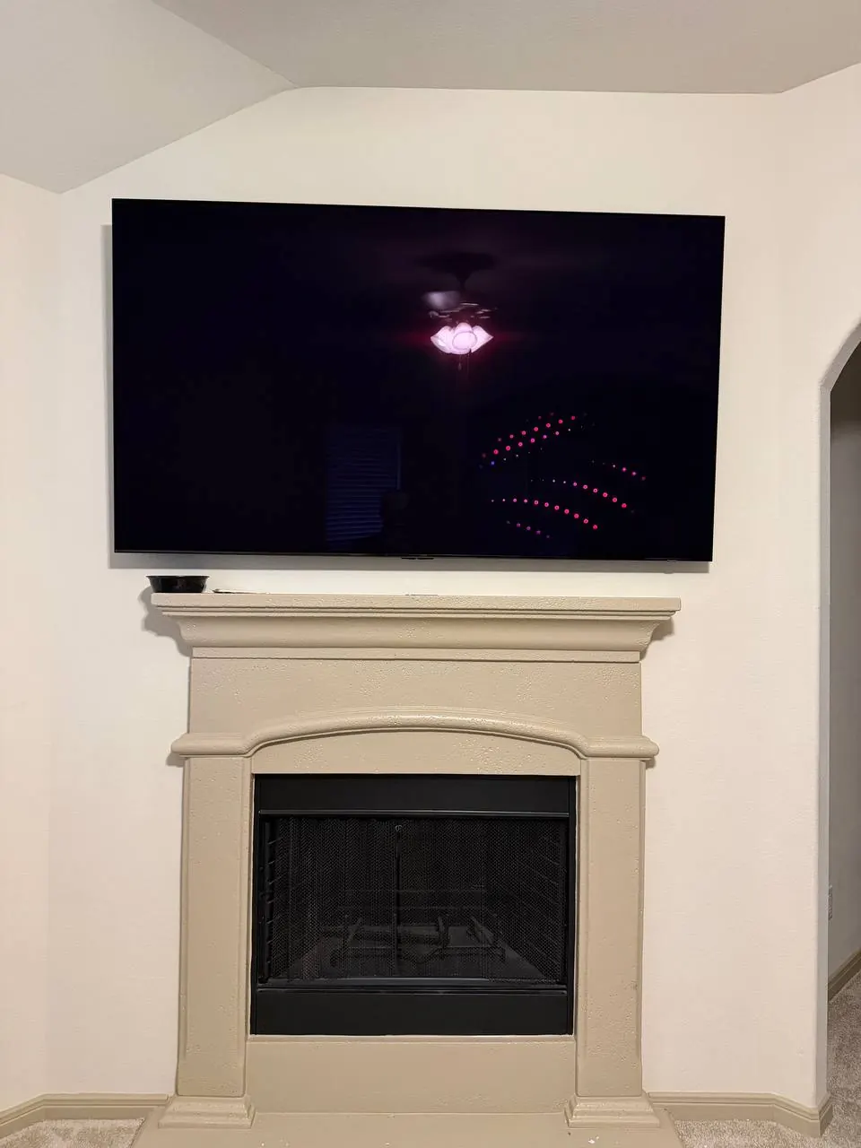 TV mounted above fireplace with concealed wires, Houston TX #7