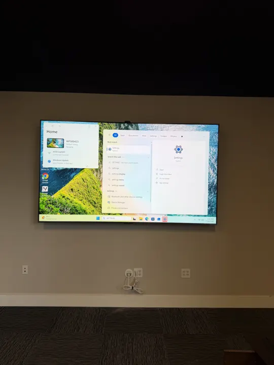 TV mounted on a living room wall, Houston TX
