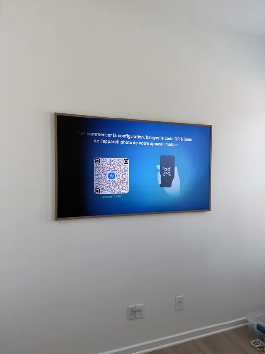 Frame TV mounted flush on a living room wall, Houston TX