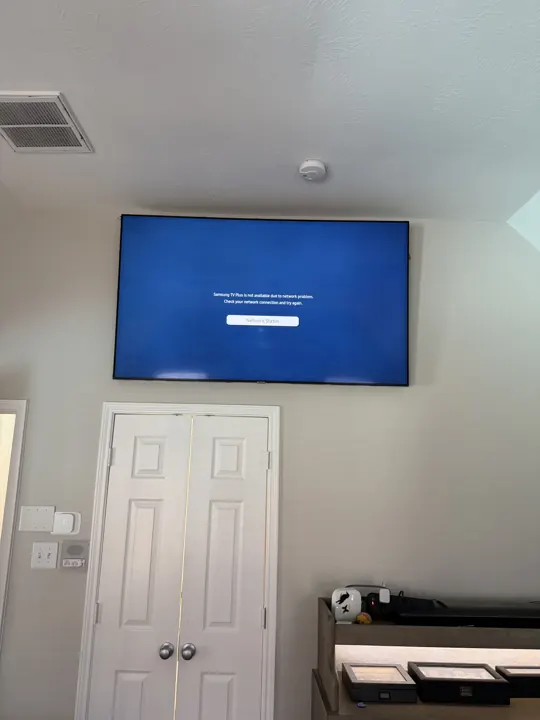 TV mounted above a doorway, Houston TX